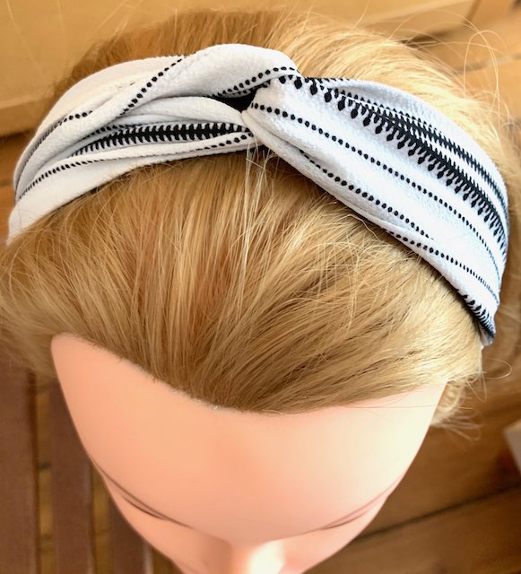 White headband with black stripes salad-dressing