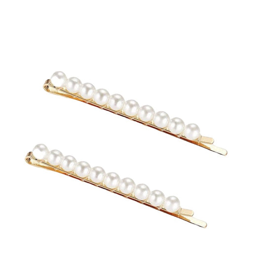 two barrettes adorned with white pearls