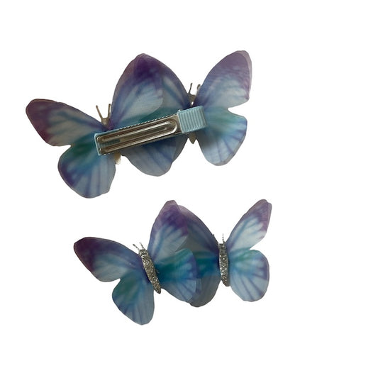 two blue butterfly barrettes